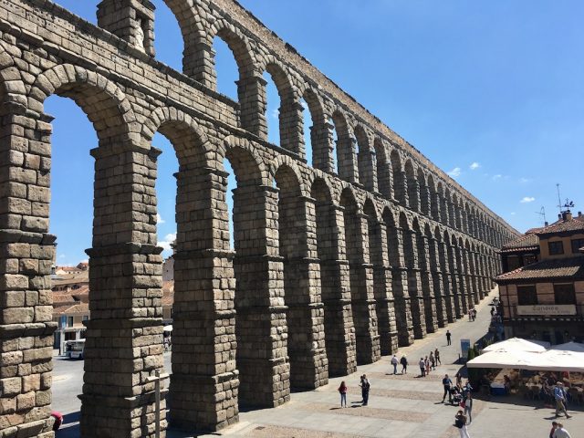The aqueduct cutting through the central plaza of Segovia