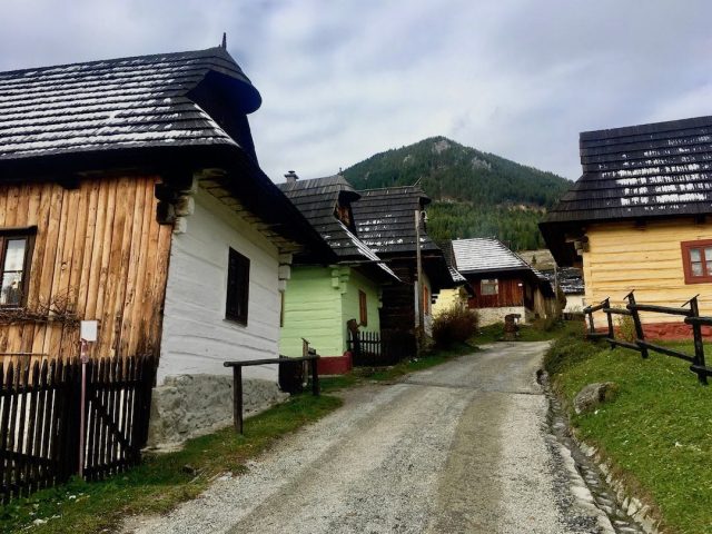 The colourful houses in Vlkolínec with a dusting of early snow