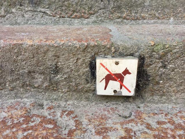 Sign forbidding dogs at the abbey at Mont-Saint-Michel