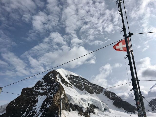 Jungfraujoch in Switzerland with Swiss flag
