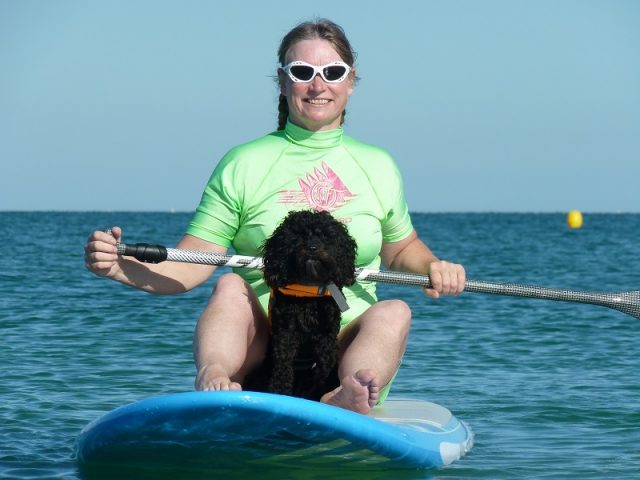 Jacqueline Lambert on a SUP with her dog