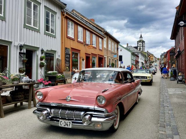 Classic cars cruising the main street of Røros