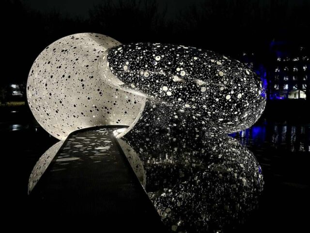 Ouroboros Sculpture at Night